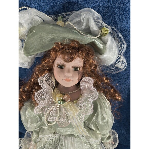 Cathay Collection Victorian Style Porcelain Doll with Green Dress and Hat - Picture 3 of 7